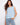 Blue floral top with a crew neckline, perfect for casual outings. The sleeveless design adds a touch of elegance. By Charlie B.