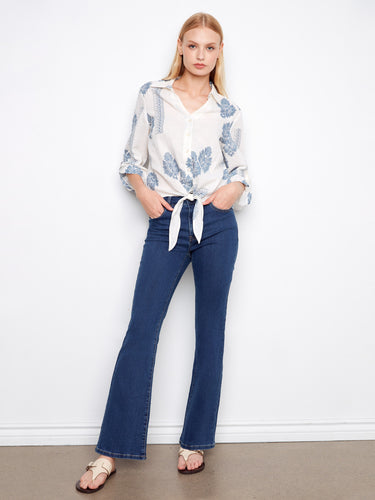 Casual shirt with button closure and elegant detailing, ideal for versatile styling options. Designed by Charlie B.
