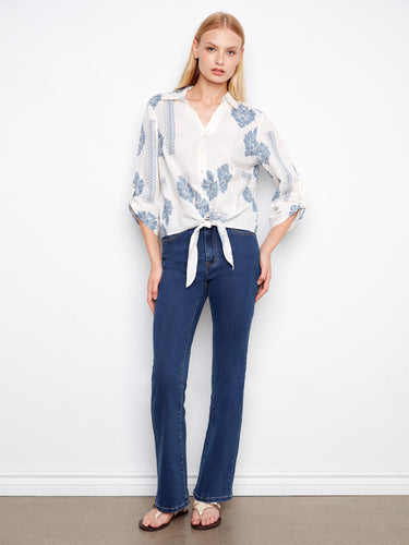Trendy top blending comfort and style with unique patterns on light fabric. Effortlessly chic by Charlie B.