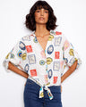 Blouse with postcard print featuring a V-neck and short adjustable sleeves, perfect for casual outings by Charlie B.