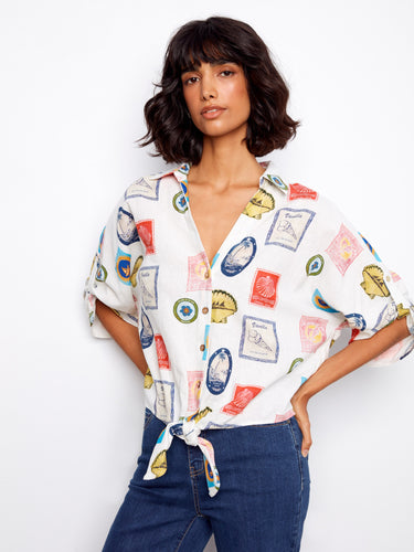 Vibrant postcard print blouse with button-up design, complete with a fashionable front tie accent by Charlie B.