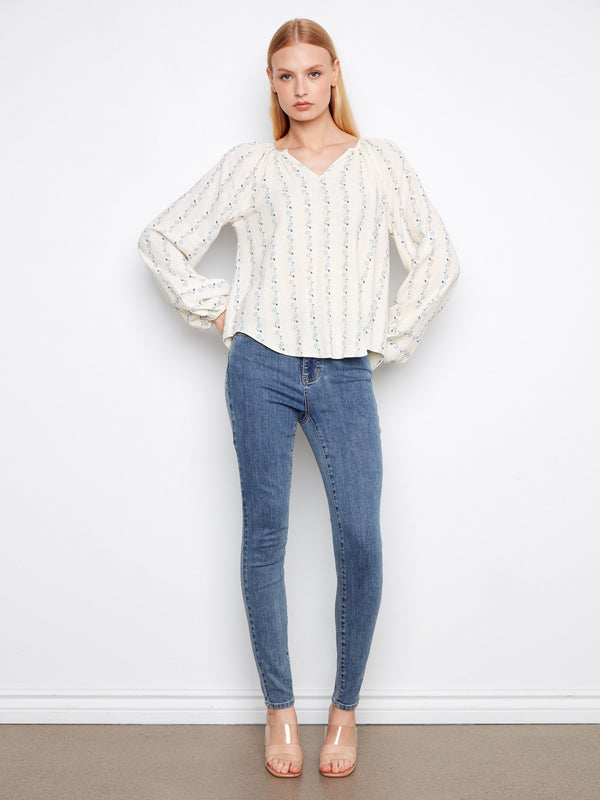 Chic blouse featuring long raglan sleeves that add elegance to any outfit. Ideal for both day and night wear by Charlie B.