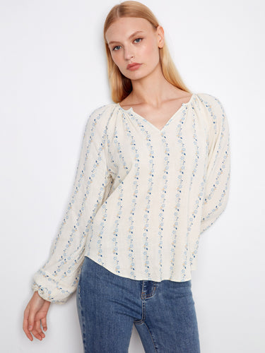 Delicate floral design on this blouse with a rounded hem adds a feminine touch to your wardrobe essentials by Charlie B.