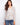 Raglan blouse featuring a paisley print and crochet trim, highlighted with a stylish notch neckline by Charlie B.