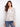 Raglan blouse featuring a paisley print and crochet trim, highlighted with a stylish notch neckline by Charlie B.