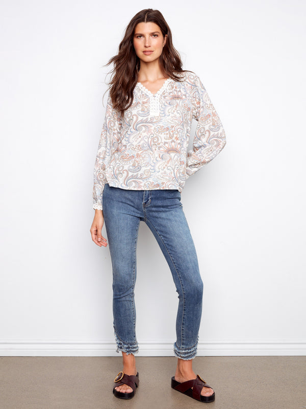 Elegant blouse with raglan sleeves and intricate paisley design, complete with crochet-trimmed cuffs by Charlie B.