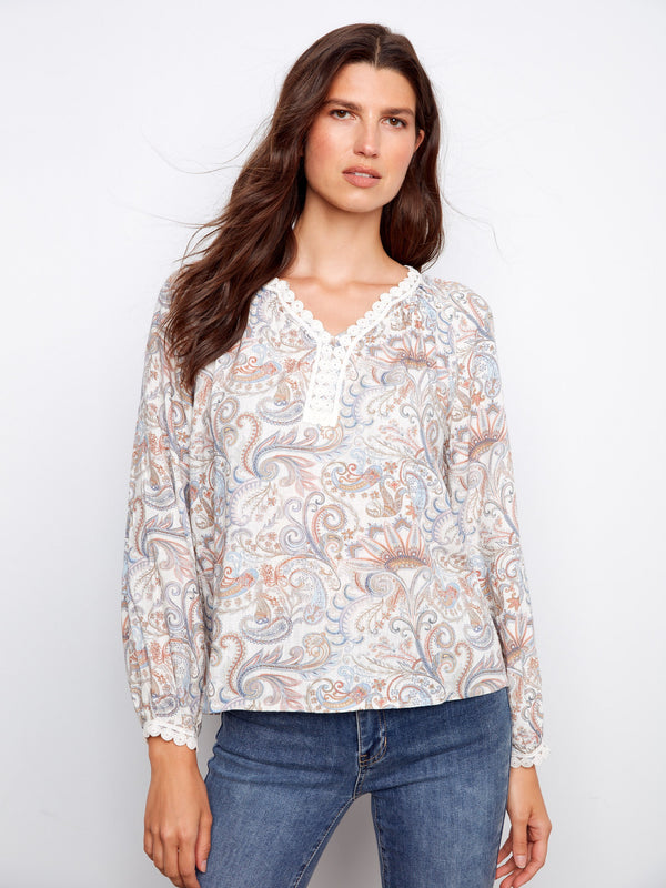 Chic raglan sleeve blouse adorned in paisley patterns, accentuated by a beautifully crafted notch neckline by Charlie B.