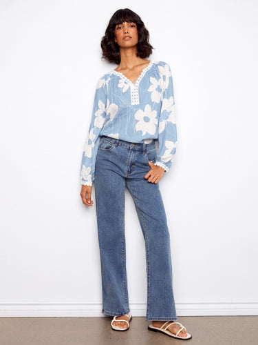 Casual yet chic blouse featuring beautiful raglan sleeves and crochet-trimmed cuffs for effortless style by Charlie B.