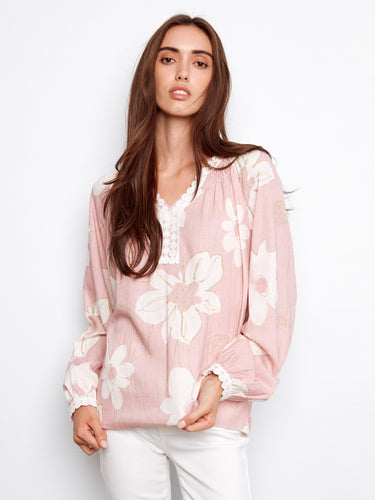 Chic blouse adorned with crochet trim at the cuffs, offering a stylish touch to your wardrobe essentials. By Charlie B.