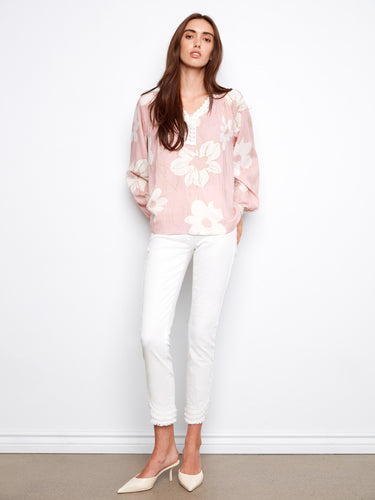 Stylish raglan sleeve top with intricate crochet detailing, perfect for adding flair to any outfit. By Charlie B.