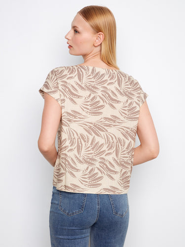 Printed top showcasing a sophisticated boat neckline, adding charm to your everyday style by Charlie B.