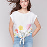 Blouse featuring a crew neckline with vibrant floral accents by Charlie B.