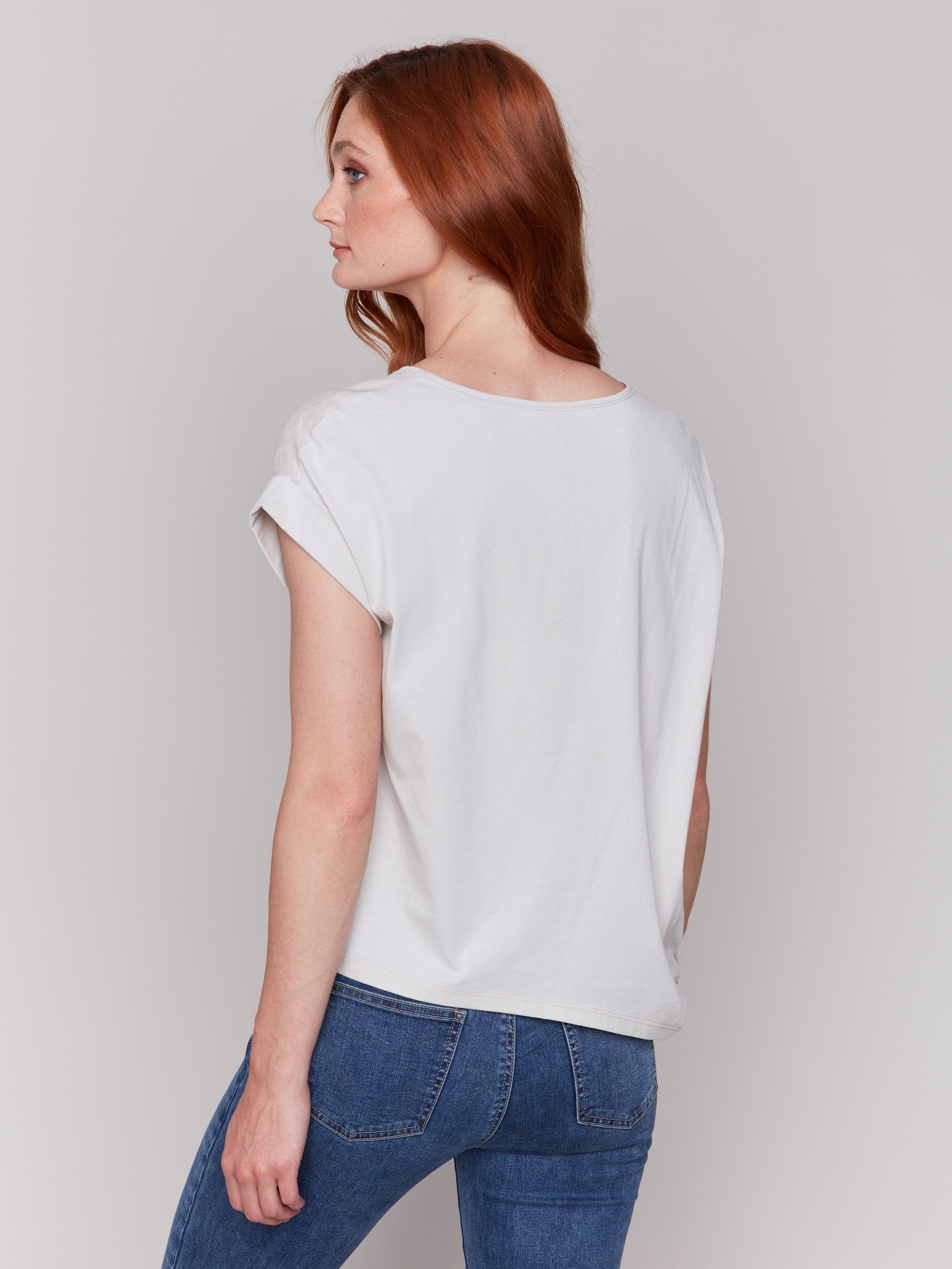 Dolman sleeves with folded cuffs on palm print top by Charlie B.