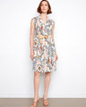 Floral dress featuring a tailored neckline and vibrant pattern, perfect for any occasion. Designed by Charlie B.