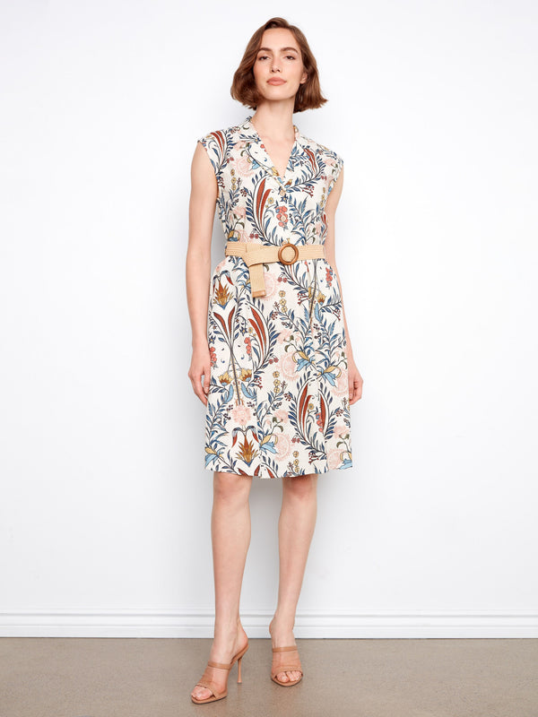 Floral dress featuring a tailored neckline and vibrant pattern, perfect for any occasion. Designed by Charlie B.