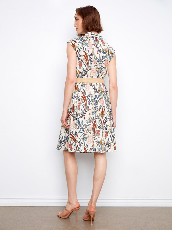 Functional two pockets add practicality to this beautiful floral-patterned dress. Fashioned by Charlie B.