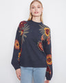 Navy sweater with long balloon sleeves and boho floral pattern, crafted by Charlie B.