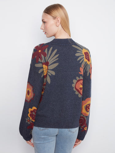 Stylish navy blue sweater showcasing intricate floral patterns and long sleeves by Charlie B.