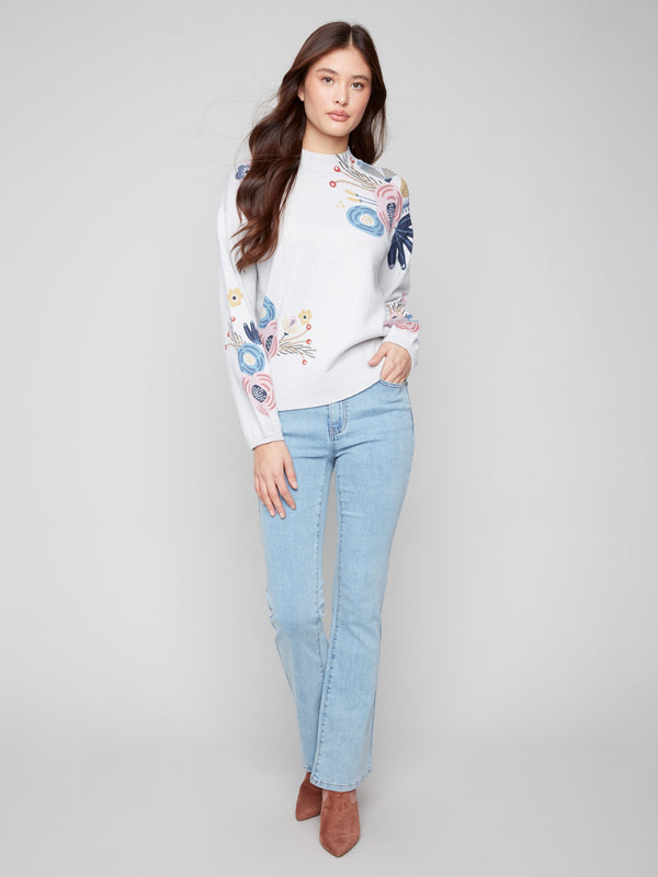 Chic heather grey sweater adorned with floral prints, complete with elastic cuffs for added comfort by Charlie B.