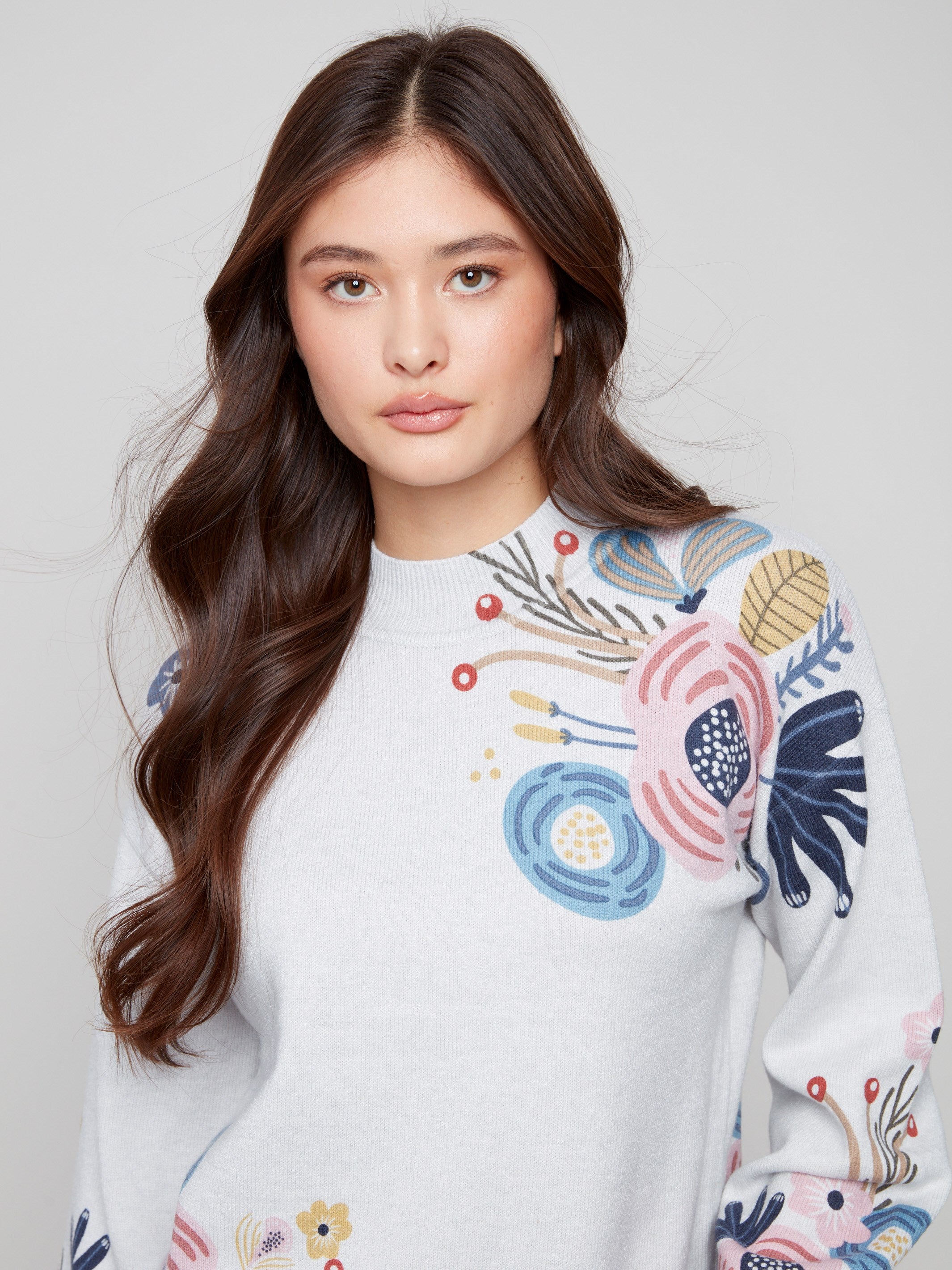 Stylish heather grey sweater with vibrant floral patterns and comfortable balloon sleeves by Charlie B.