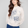 Heather oat sweater with a mock neck and delicate floral print, featuring long balloon sleeves by Charlie B.
