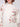 Chic mock neck sweater adorned with charming floral patterns, offering comfort and style by Charlie B.