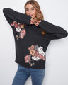 Floral pattern sweater with a mock neckline, offering a stylish and modern look. Perfect for casual outings. By Charlie B.
