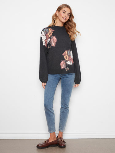 Drop shoulder design enhances the relaxed fit of this floral sweater, adding comfort and style to your wardrobe. By Charlie B.