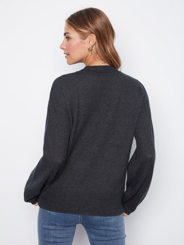 Mock neckline complements the floral design on this cozy sweater, perfect for layering in cooler weather. By Charlie B.