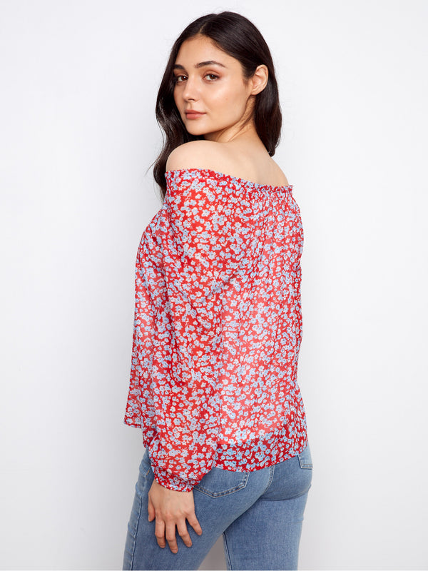 Stylish off-the-shoulder blouse with a rustic floral pattern and balloon sleeves, offering a breezy fit by Charlie B.
