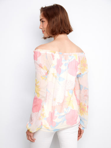 The delicate floral design on this top adds a touch of femininity and charm to your wardrobe. By Charlie B.