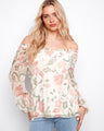 Blouse with a charming off-the-shoulder neckline, showcasing a delicate floral design, perfect for a casual yet elegant look by Charlie B.