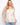 Blouse with a charming off-the-shoulder neckline, showcasing a delicate floral design, perfect for a casual yet elegant look by Charlie B.