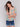 Colorful and comfortable, this blouse boasts a trendy design by Charlie B.