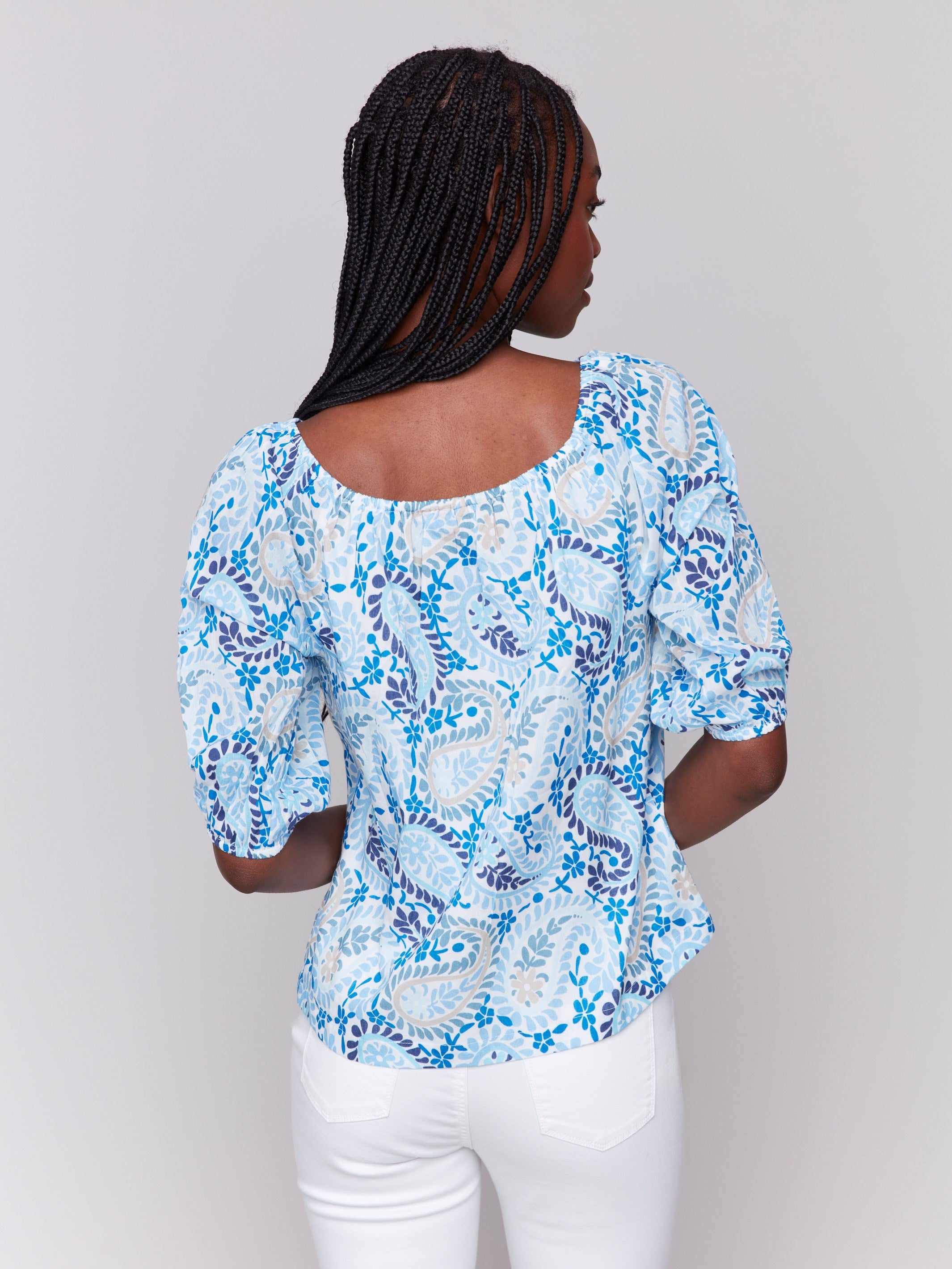 Elegant off-the-shoulder blue blouse made from pure cotton with a unique paisley design by Charlie B.