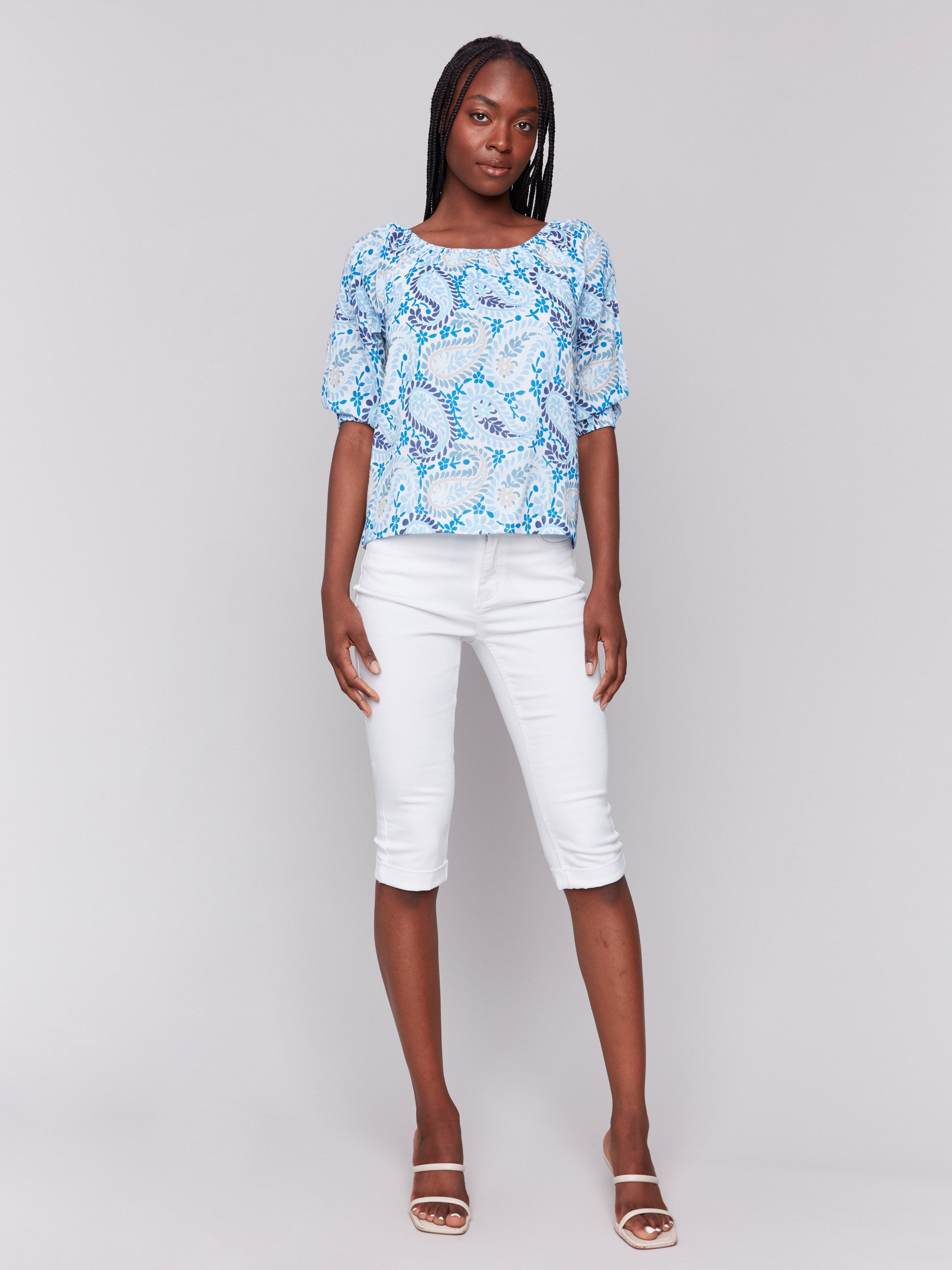 Stylish blue paisley print blouse featuring three-quarter length sleeves by Charlie B.
