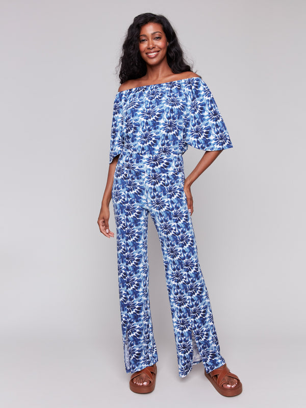 Off-the-shoulder blue top with vibrant floral patterns by Charlie B.