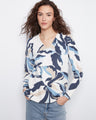 Stylish sweater with a V-neck, featuring a unique pattern and vibrant colors for a chic look by Charlie B.