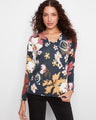 Floral sweater with a flattering V-neck, showcasing its elegant design by Charlie B.