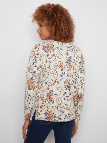 Elegant floral printed sweater featuring a drop shoulder and stylish side slits by Charlie B.