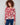 Floral sweater featuring plush texture and vibrant red and pink hues, perfect for cozy days by Charlie B.