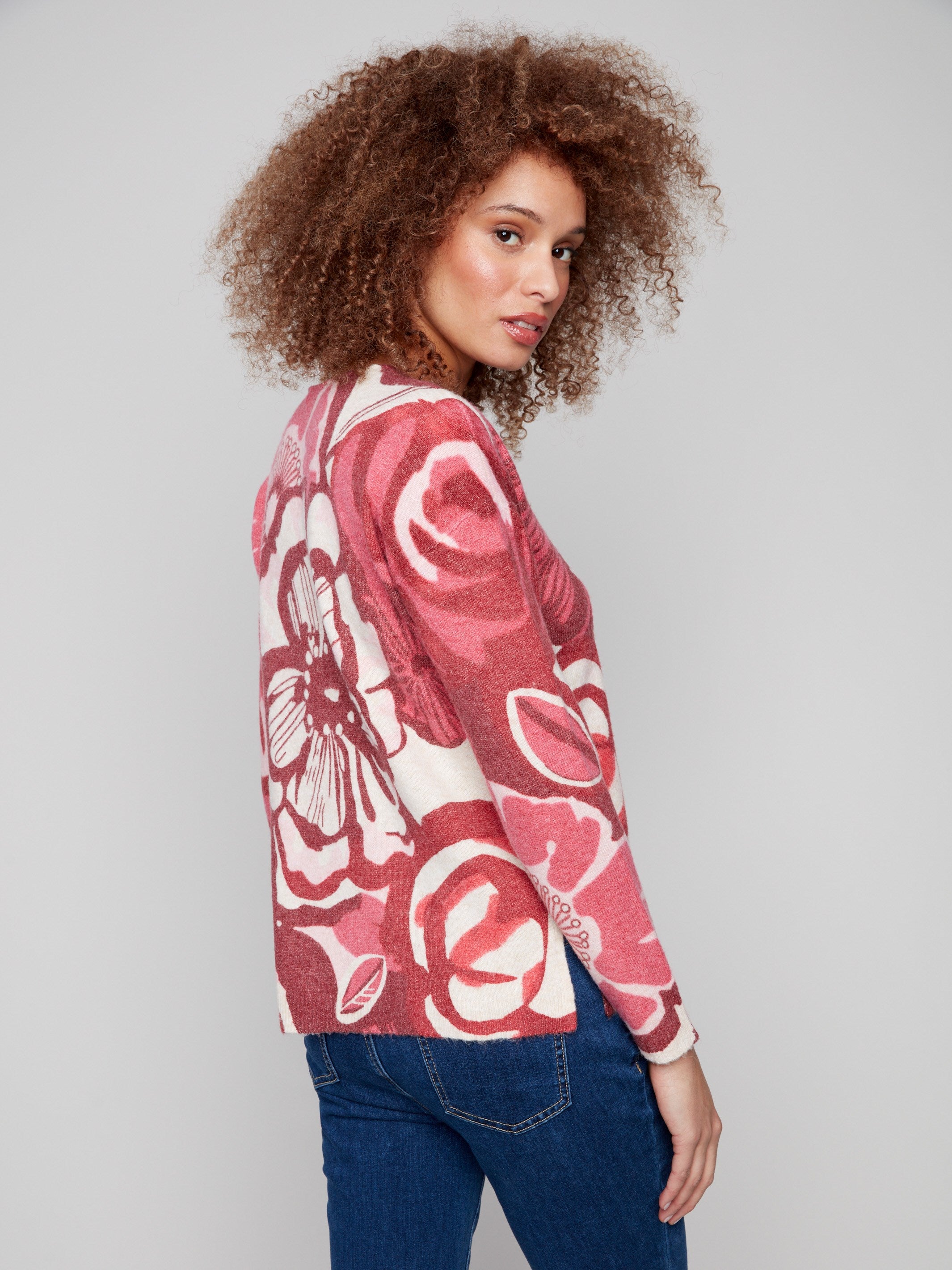 Chic floral print sweater featuring side slits for added flair in beautiful red shades by Charlie B.
