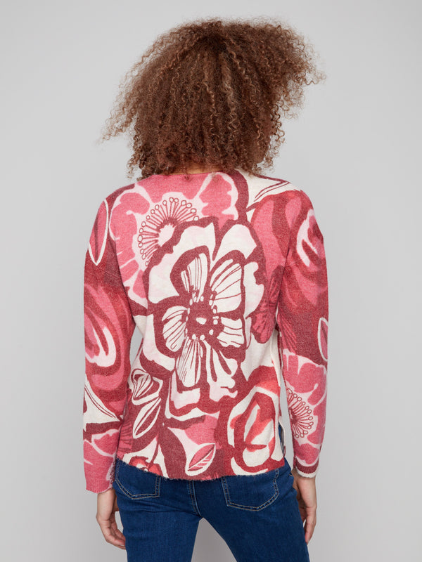 Stylish V-neck floral sweater showcasing exquisite red and pink patterns, perfect for any occasion by Charlie B.