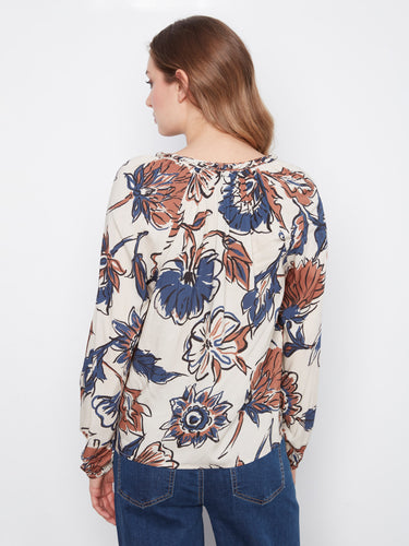 Elegant floral blouse with raglan sleeves offering a relaxed fit and chic style by Charlie B.