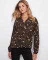 This blouse features a stylish notch neckline that adds an elegant touch to any outfit. Designed for comfort and style by Charlie B.