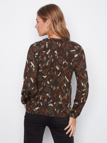 Effortlessly transition from day to night with this versatile piece that complements both jeans and skirts beautifully. By Charlie B.