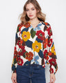 Floral blouse with a striking notch neckline, perfect for adding elegance to any outfit. Made from soft viscose fabric by Charlie B.