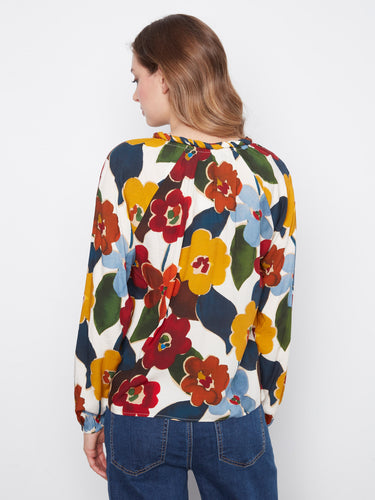 Chic floral blouse showcasing a beautiful blend of colors, ideal for enhancing your wardrobe with its relaxed fit by Charlie B.