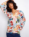Chic blouse with raglan sleeves and multicolored print, offering both comfort and style for everyday wear by Charlie B.