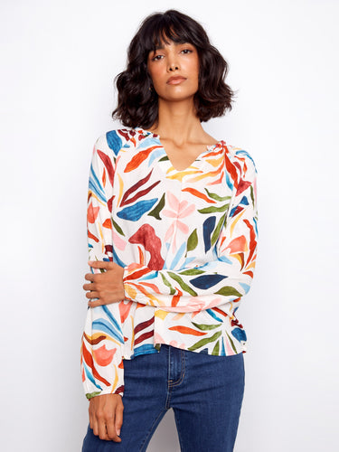 Elegant top showcasing a notched neckline and vivid abstract patterns, perfect for enhancing your wardrobe by Charlie B.